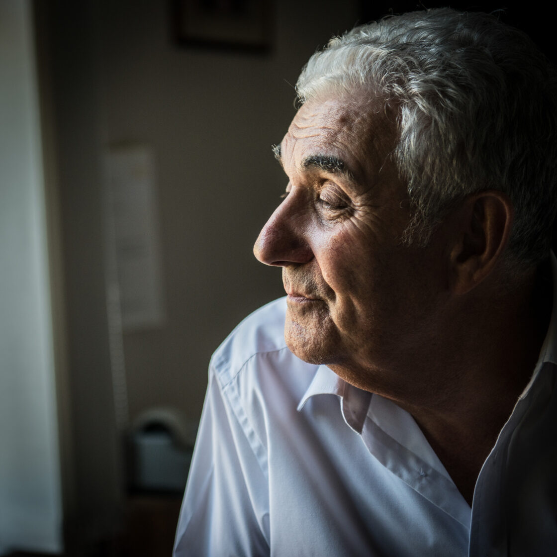 Man looking out of a window